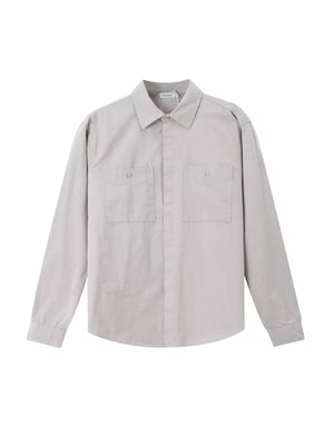 Light gray cotton button-down shirt with two chest pockets and long sleeves.