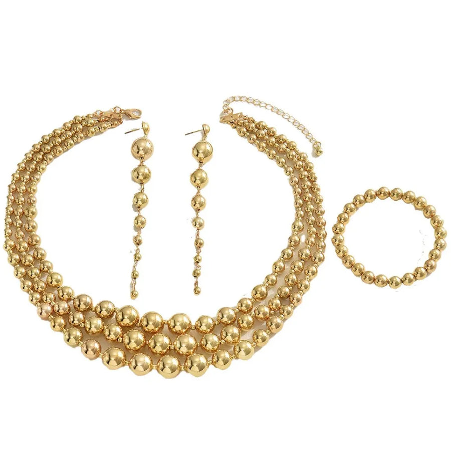 gold jewelry set with medium length necklace, long earrings and not applicable