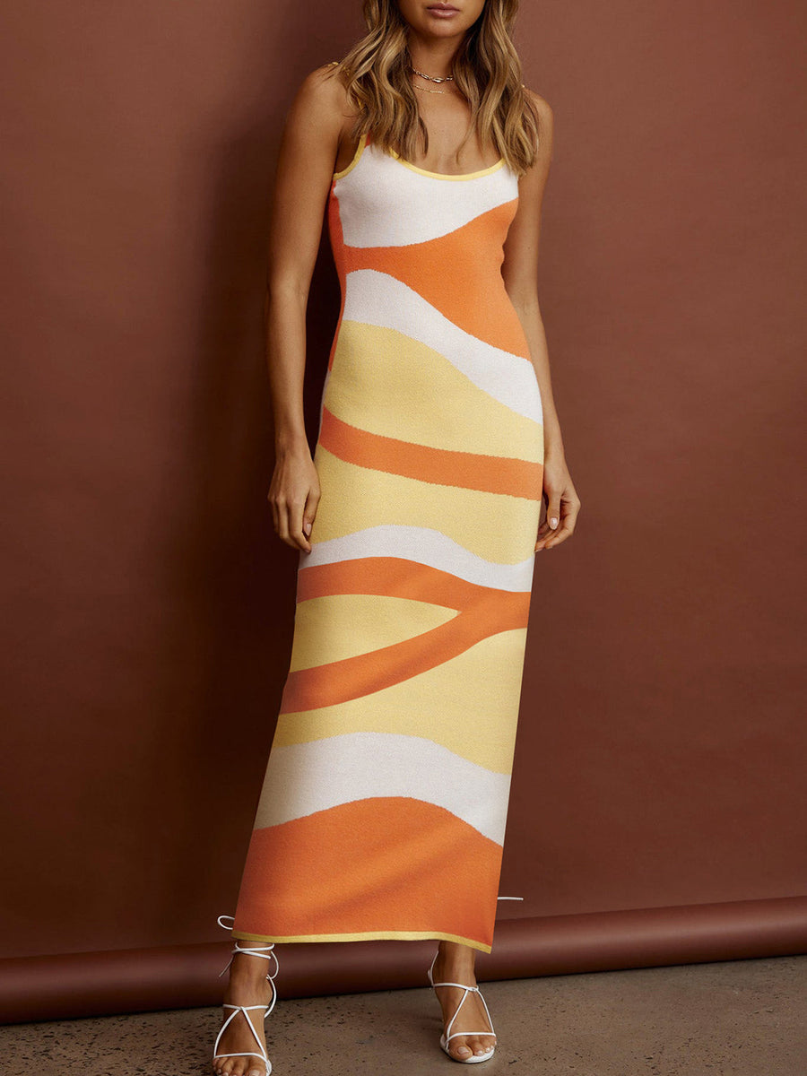 Geometric knit maxi slip dress in orange, yellow, and white wavy stripes.