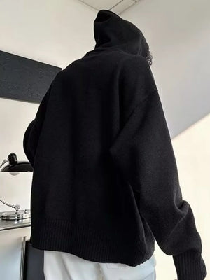 Black knit hooded sweater with button detail and ribbed cuffs and hem.