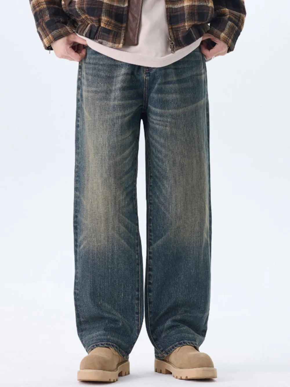 Men's relaxed fit wide-leg jeans in washed blue denim with a vintage look.