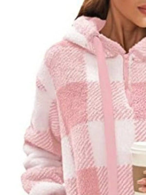 Pink plaid sherpa drawstring hoodie with fuzzy texture and white accents.
