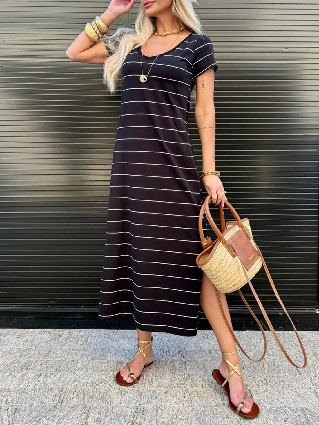 Black and white striped midi t-shirt dress with short sleeves and a v-neck.