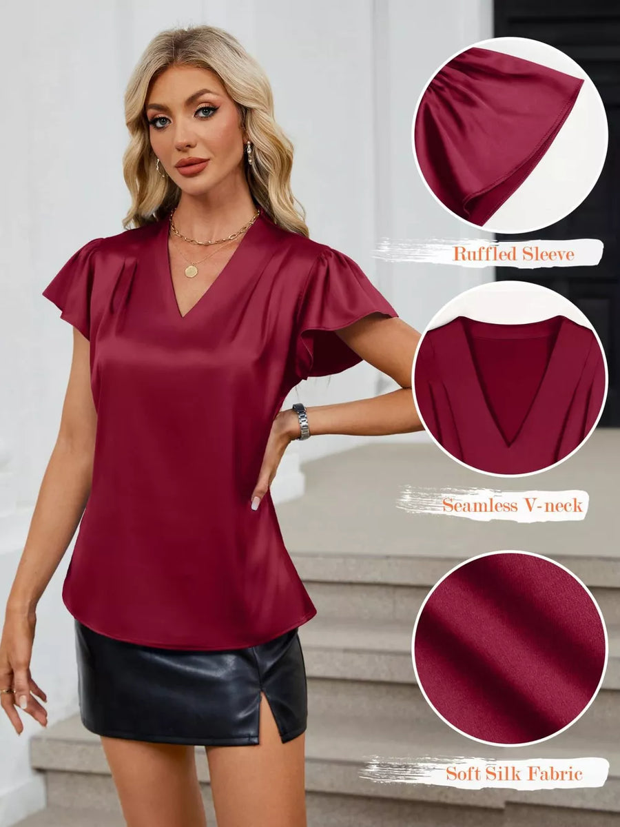 Burgundy satin V-neck blouse with ruffled flutter sleeves and a soft silk fabric feel.