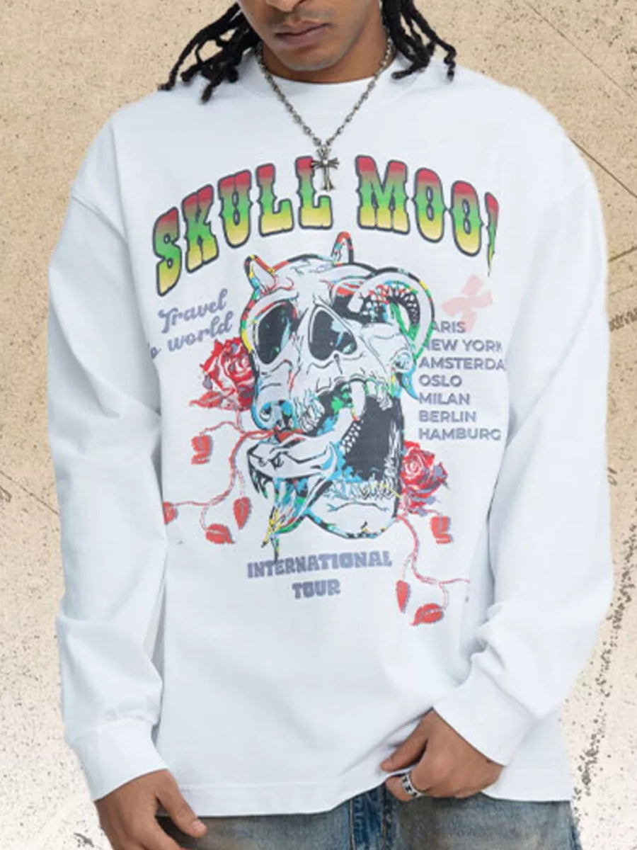 White long sleeve t-shirt with graphic skull and floral print and text.