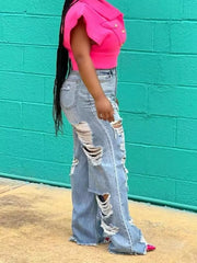 Light wash denim maternity jeans with extreme distressing and wide legs.
