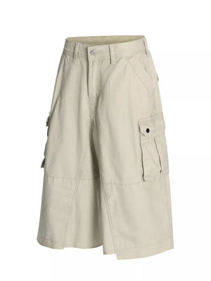 Men's apricot cargo shorts with multiple pockets and utility details.