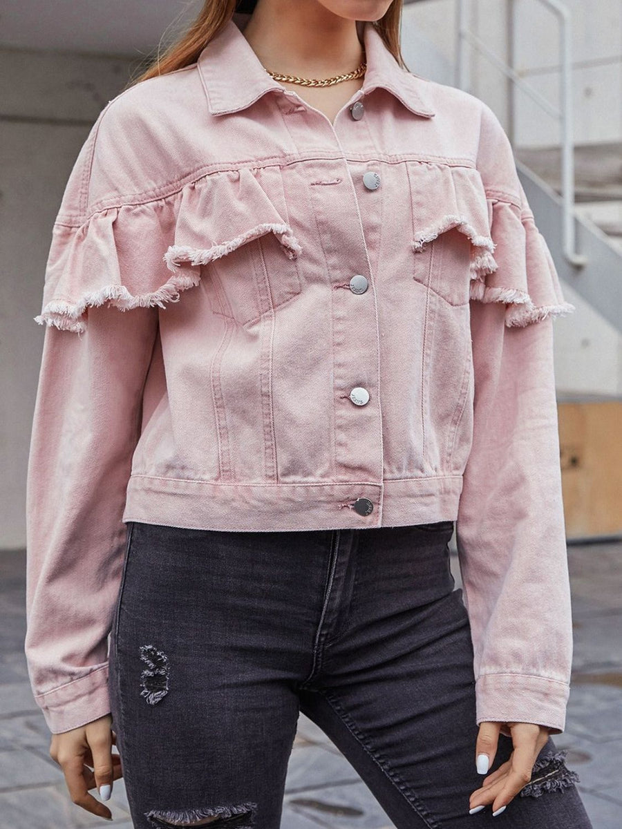 Blush pink denim trucker jacket with frayed ruffle details on the shoulders and sleeves.