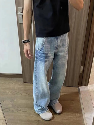 Men's light wash distressed wide leg jeans with vintage look.