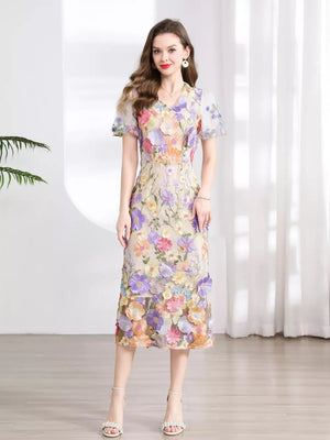 Sheath dress with floral embroidery, v-neck, short sleeves, and midi length.