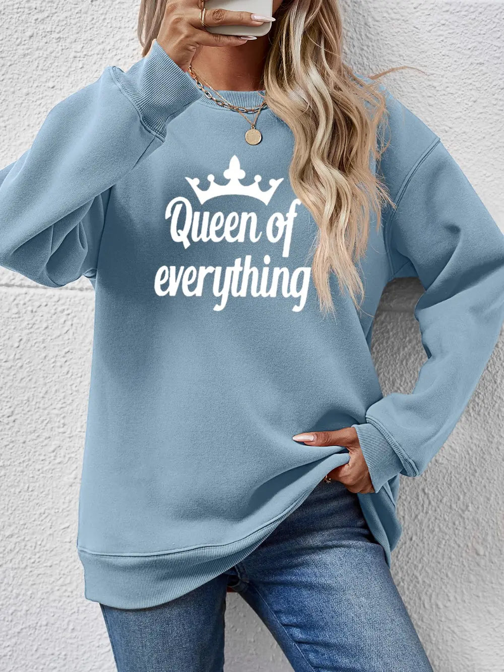 Misty Blue graphic sweatshirt with "Queen of everything" text and crown design.