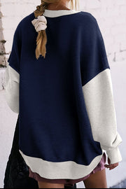 Crewneck sweatshirt with contrast navy and white colorblock design.