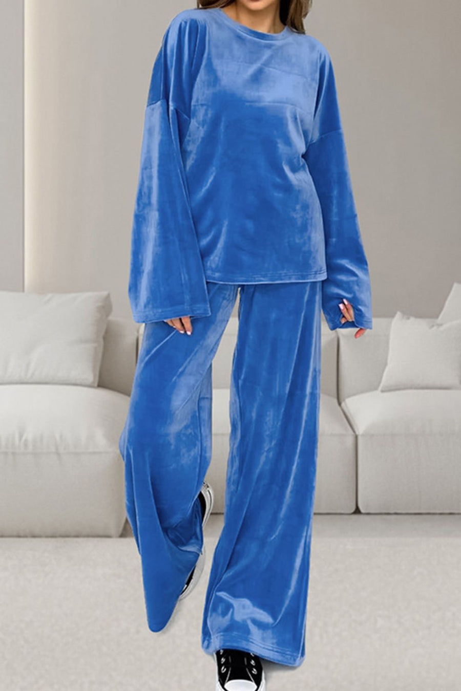 Blue velvet loungewear set with wide sleeve top and relaxed fit pants.