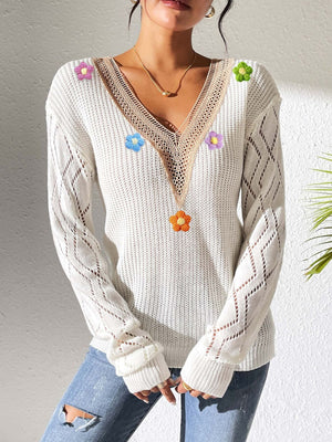 White pullover sweater featuring lace and floral