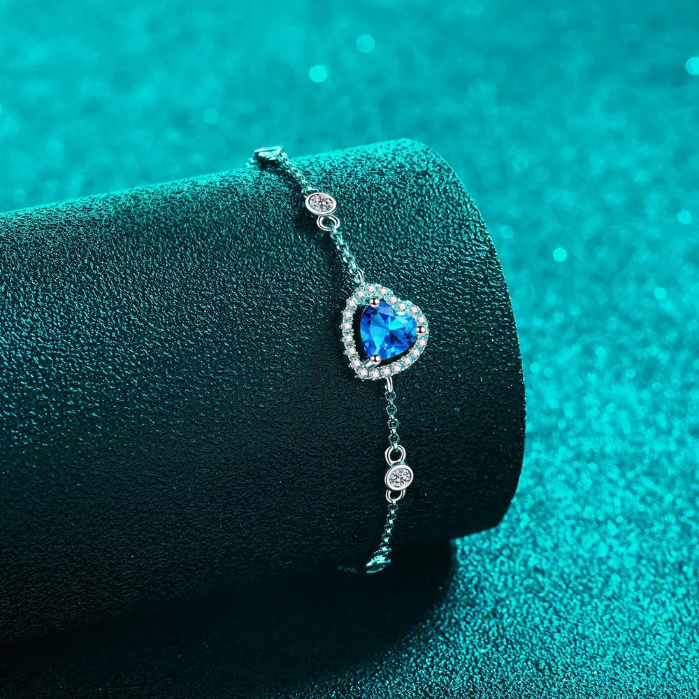 Blue heart halo moissanite bracelet with adjustable chain and sparkling accents.