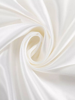 White satin fabric with soft folds and a subtle sheen