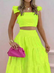 Lime ruffled crop top and tiered maxi skirt set with smocked waist.