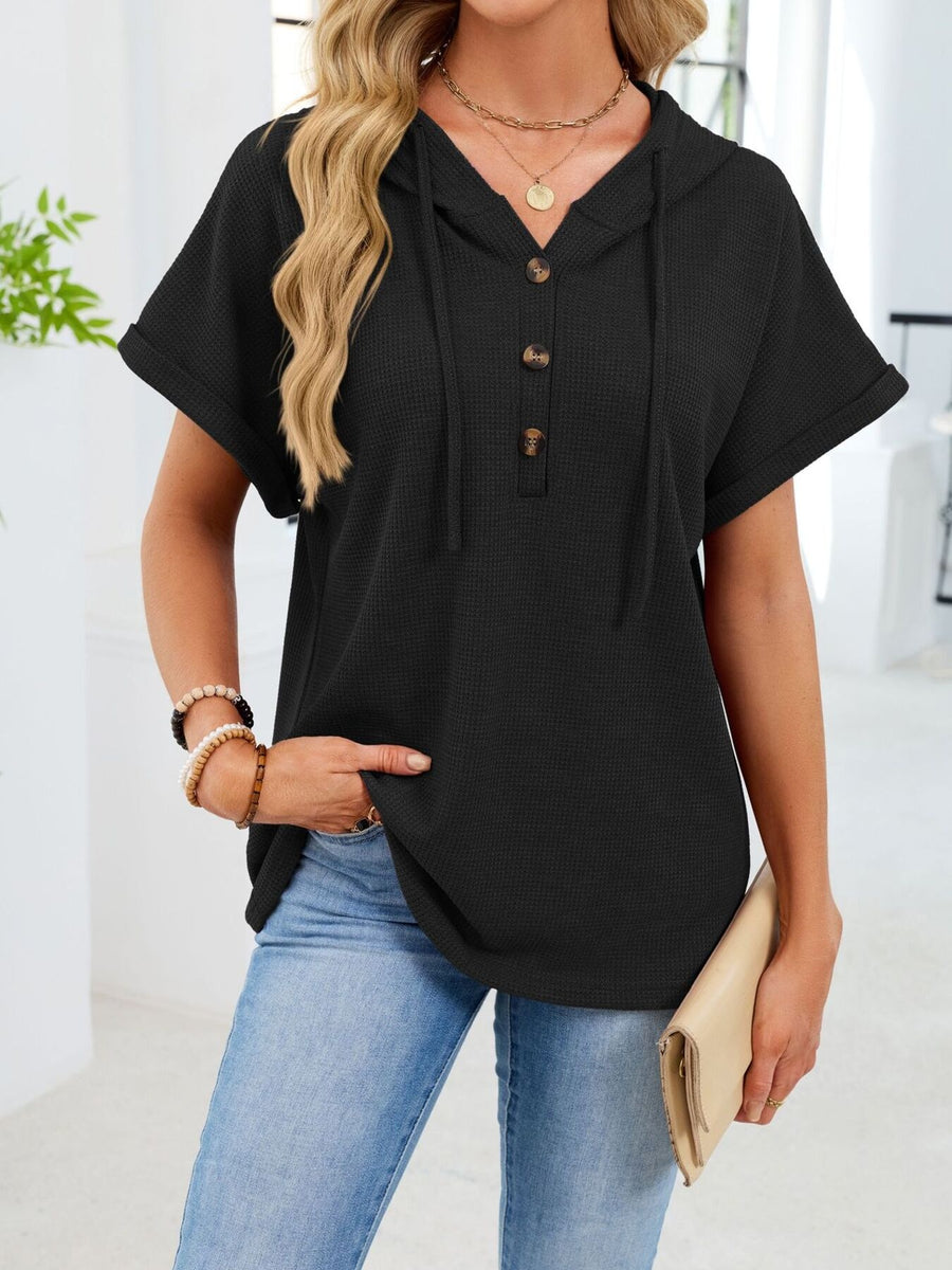 Black waffle knit short sleeve hooded top with button placket and drawstring.
