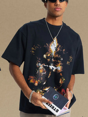 Black oversized t-shirt with abstract fiery graphic print and crew neck.