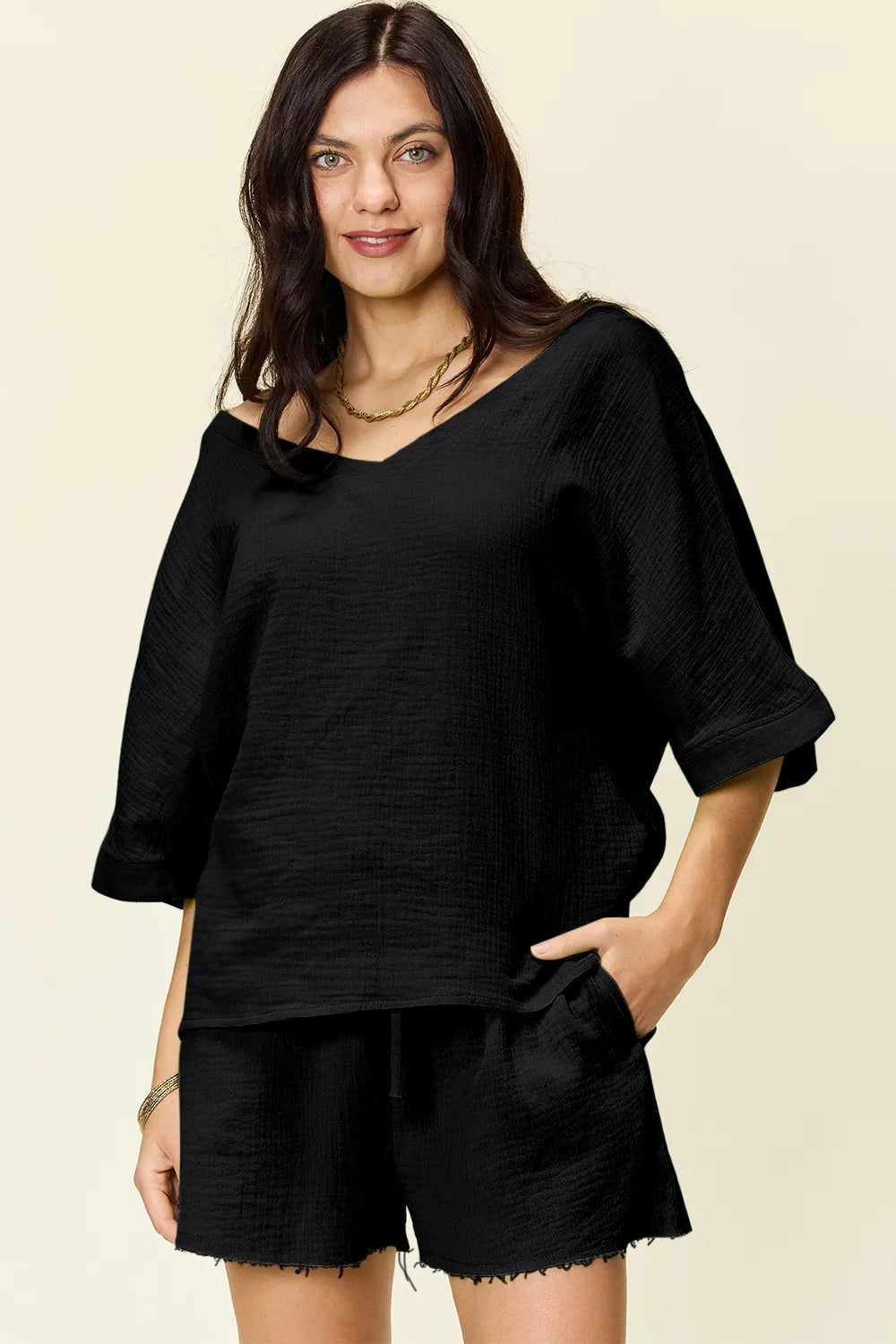 Black cotton textured half sleeve top and drawstring shorts set.