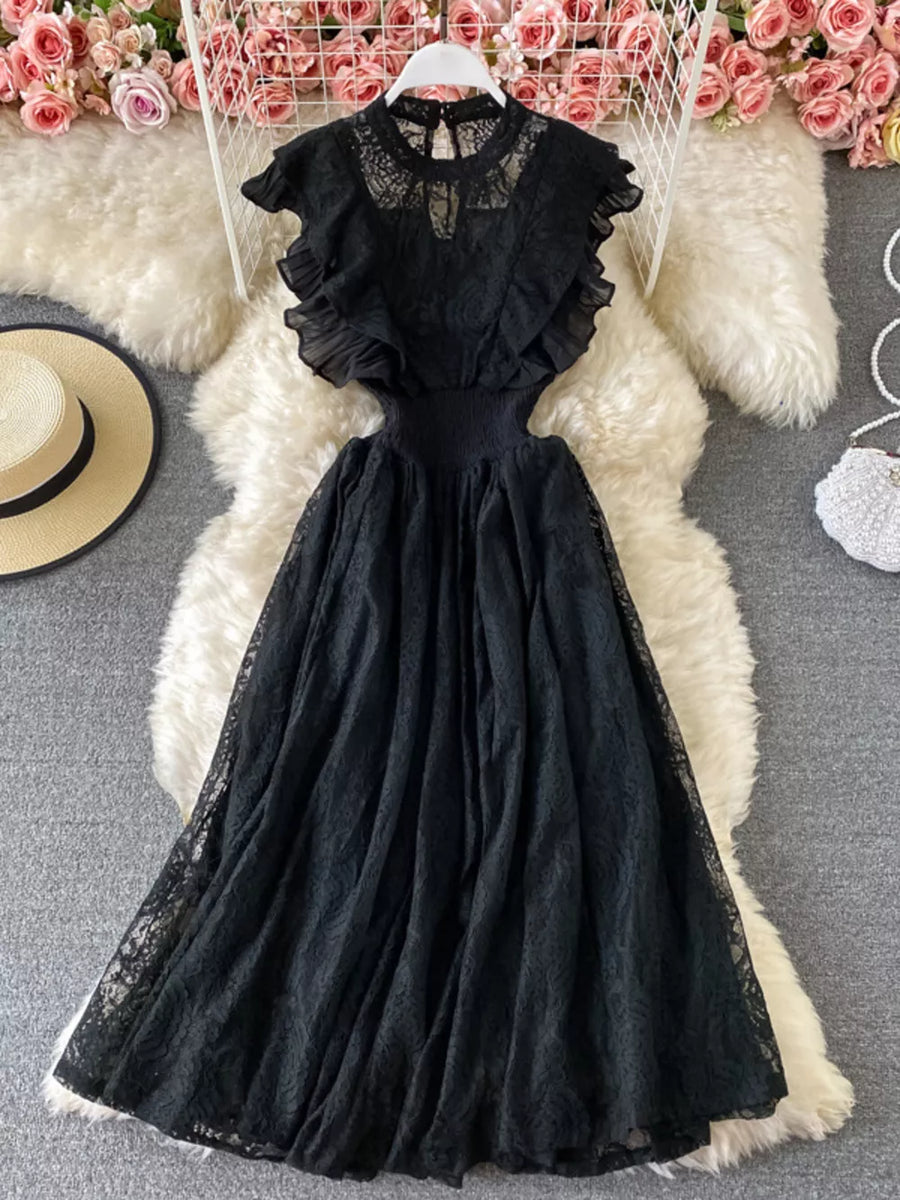 Black lace maxi dress with ruffles, cutout waist, and high neckline.