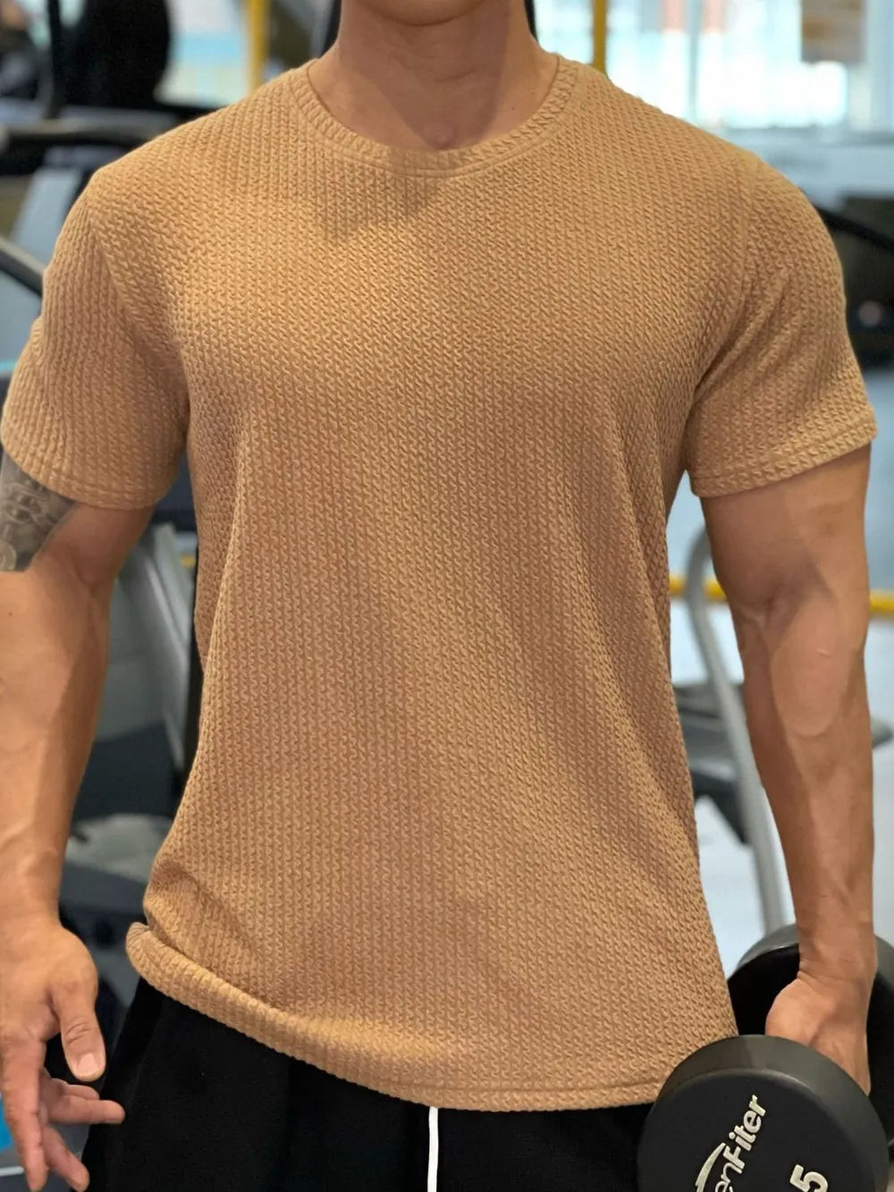 Textured performance crew neck tee in camel with short sleeves and a waffle knit pattern.