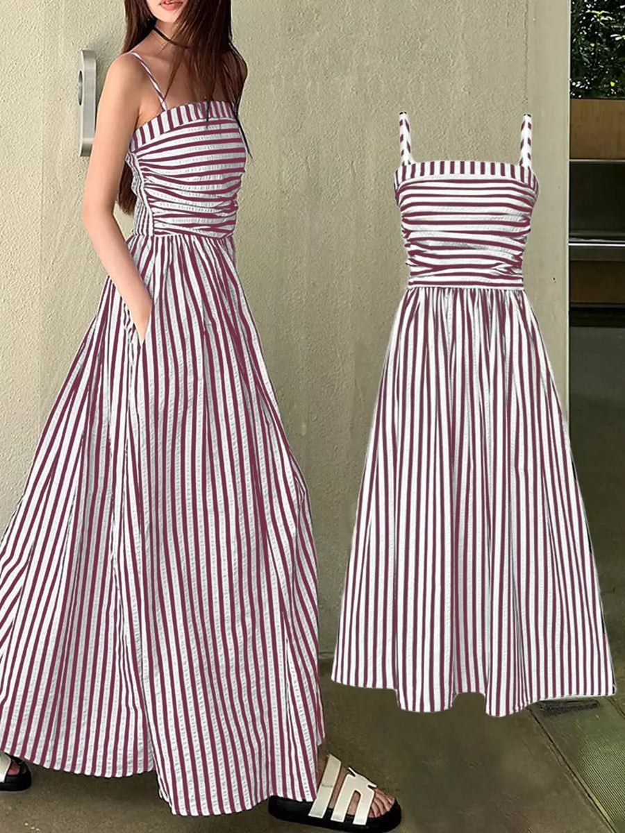 Maxi dress with pink and white stripes, square neckline, spaghetti straps, and pockets.