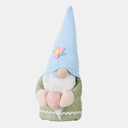 Bunny ear gnome decoration in green with pink egg and blue hat with flower.