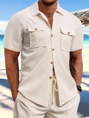 Beige textured resort shirt with patch pockets and button front.
