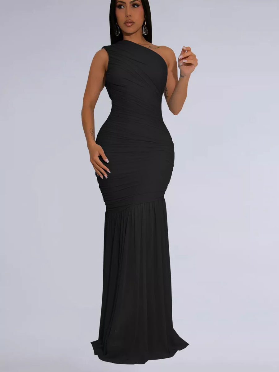 Black ruched one-shoulder bodycon maxi dress with flowing skirt.