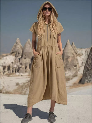 Khaki hooded midi dress with short sleeves, zip neckline, cinched waist, and functional pockets.
