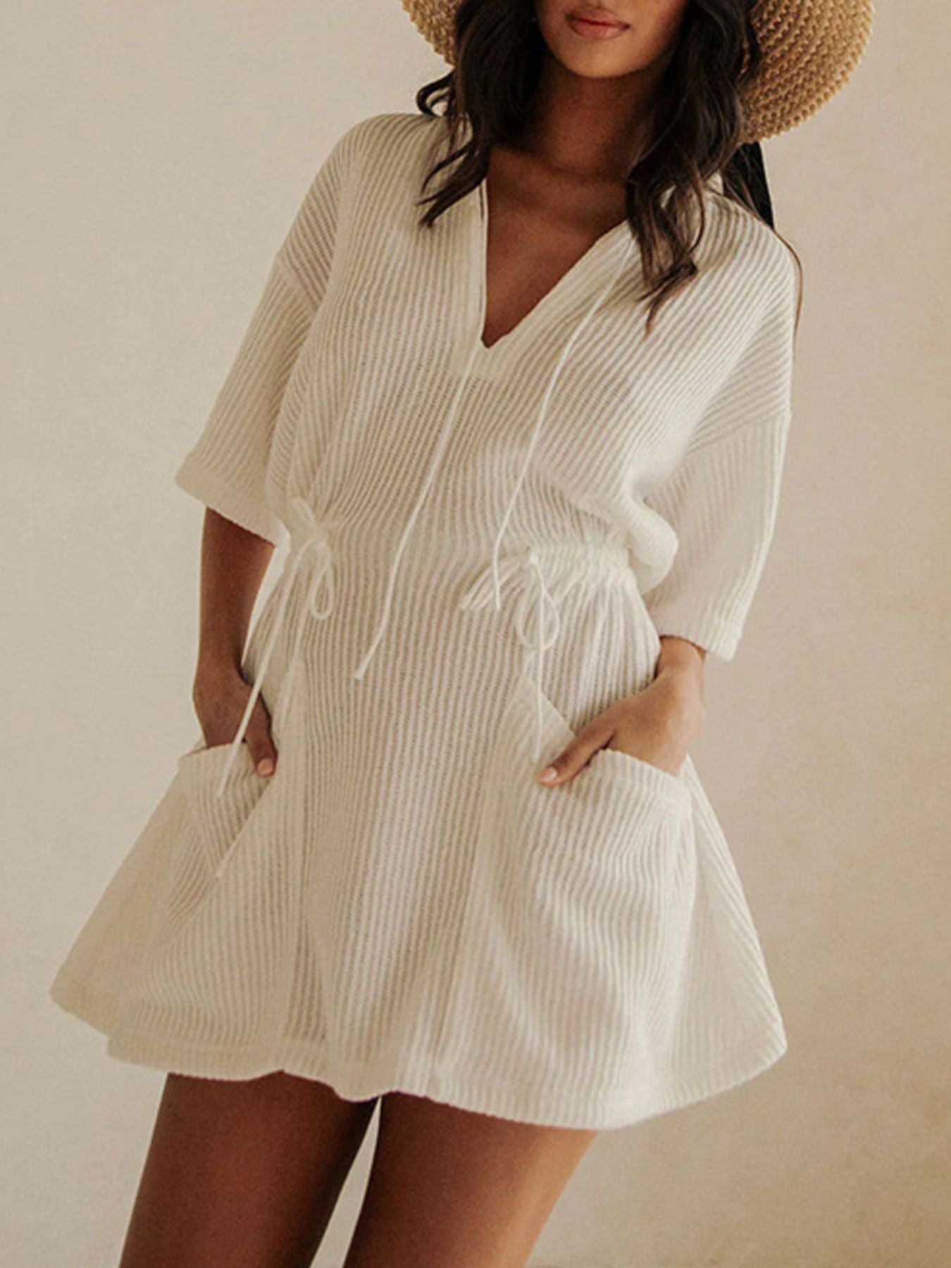 Textured white half sleeve cover-up dress with drawstring waist and pockets.