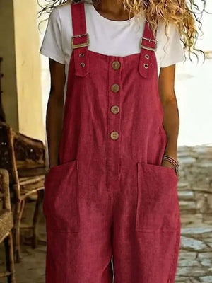 Red button-front wide leg romper with pockets and adjustable buckle straps.