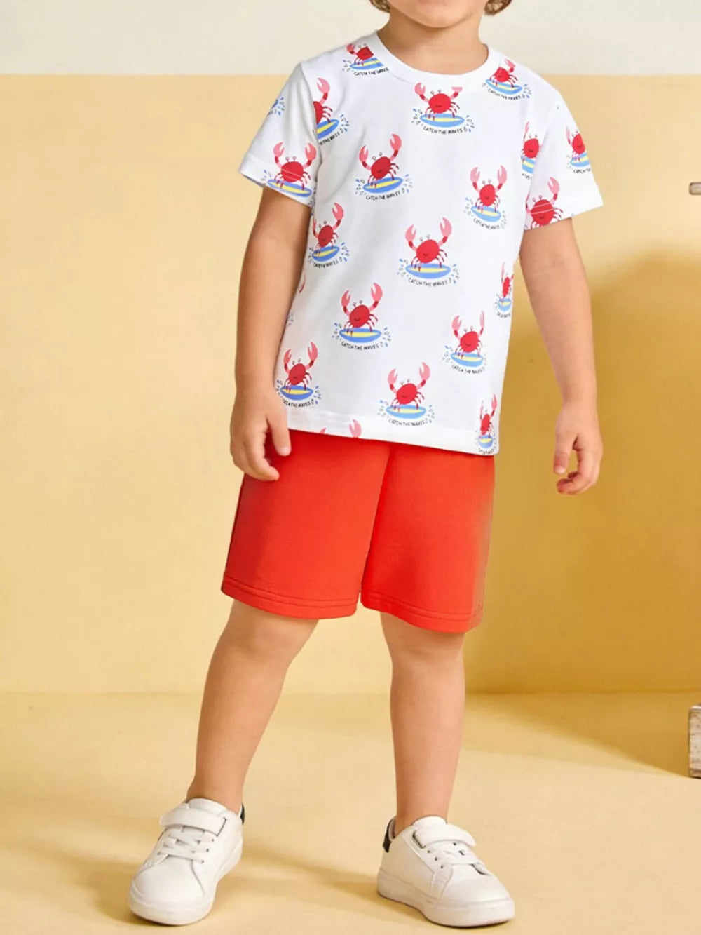 Toddler boys' white cotton t-shirt with red crab print and red shorts set.