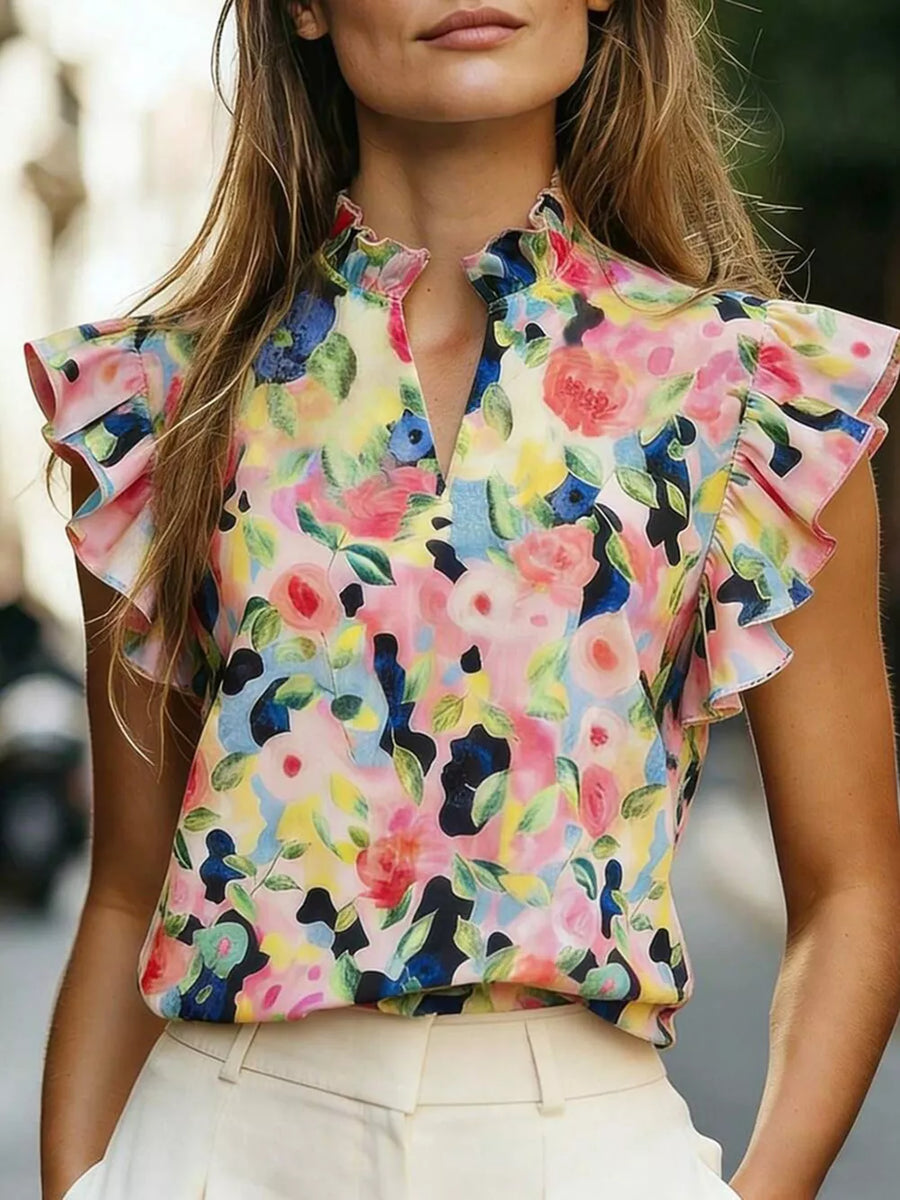Floral print ruffled sleeve shirt with mock neck and keyhole detail.