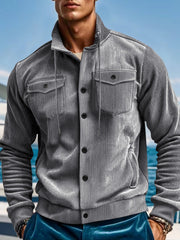 Gray corduroy bomber jacket with two chest pockets and button closure
