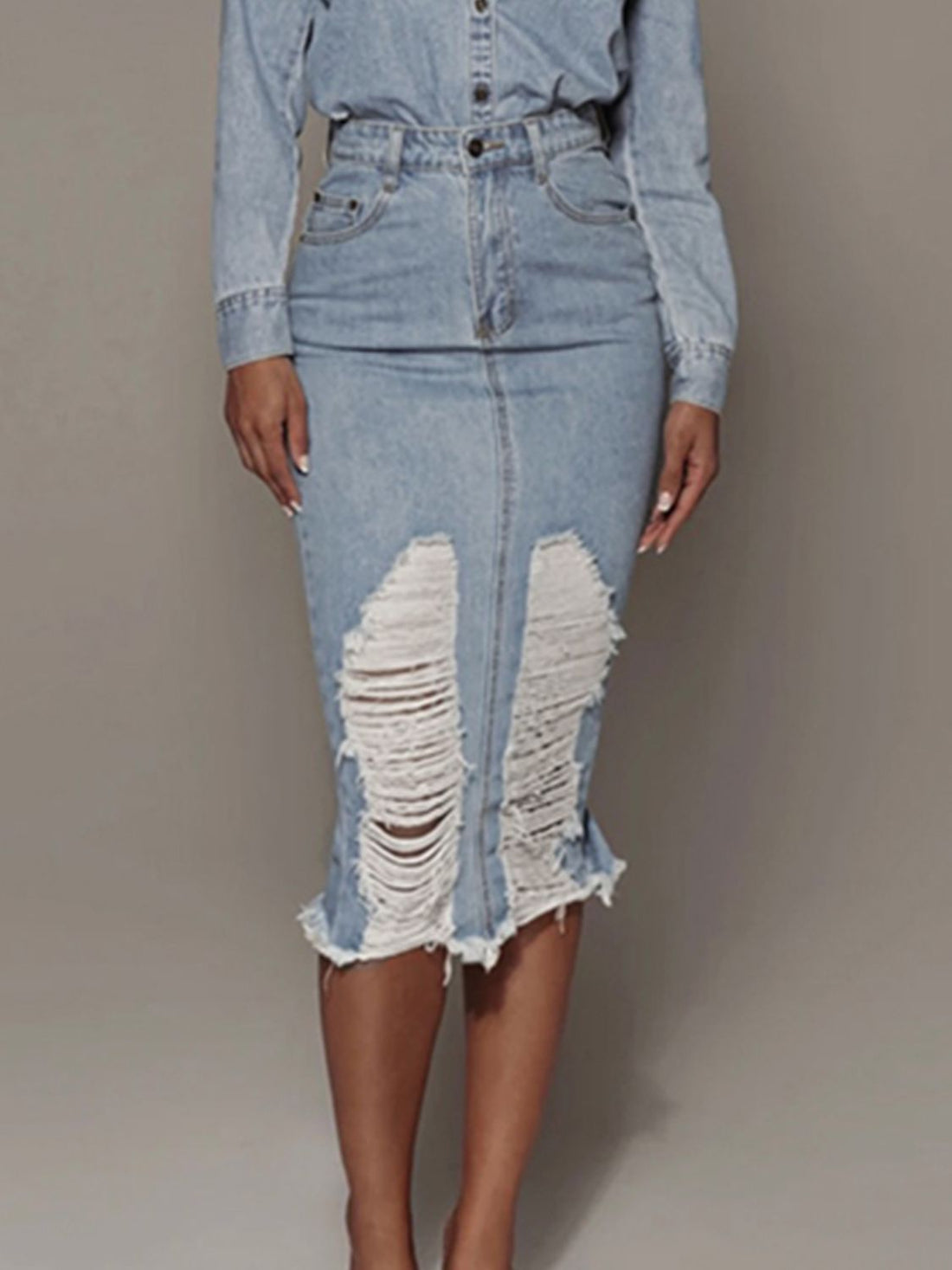 Light wash distressed denim pencil skirt with raw hem