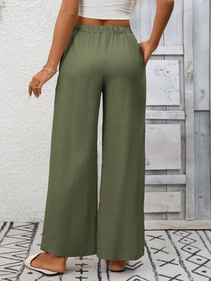Army green high-waist wide-leg pants with drawstring and pockets.