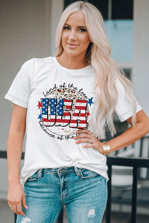 White graphic tee with USA flag design, leopard print, and patriotic text.