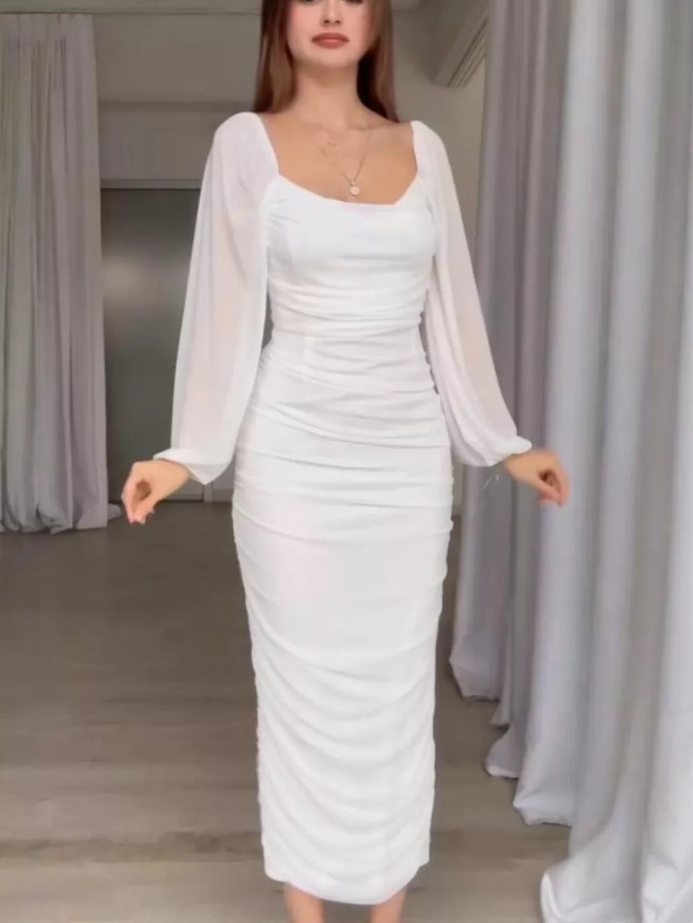 midi dress in white featuring ruched and fitted fit