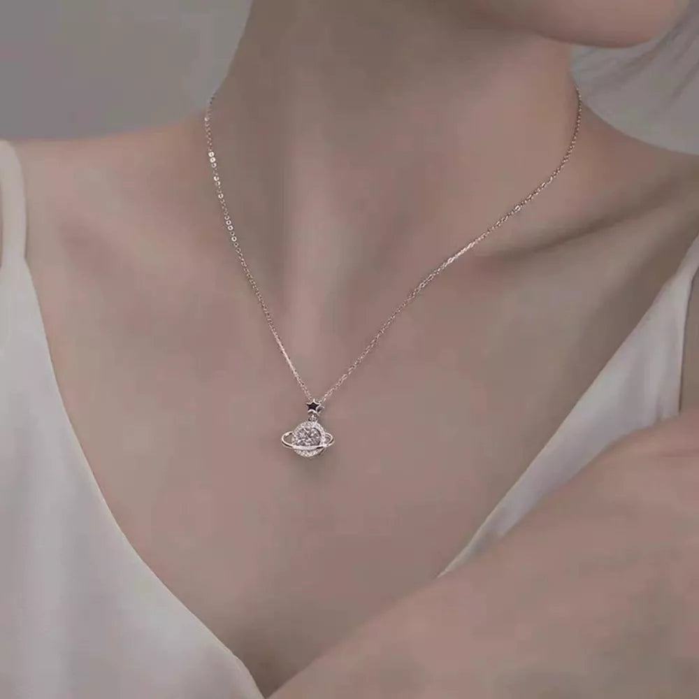 necklace in silver featuring planet pendant and delicate fit