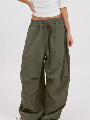 100% polyester Care instructions: Machine wash cold wide-leg pants in Black with loose silhouette