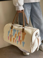 Off White canvas duffle bag with colorful star design and brown leather handles.