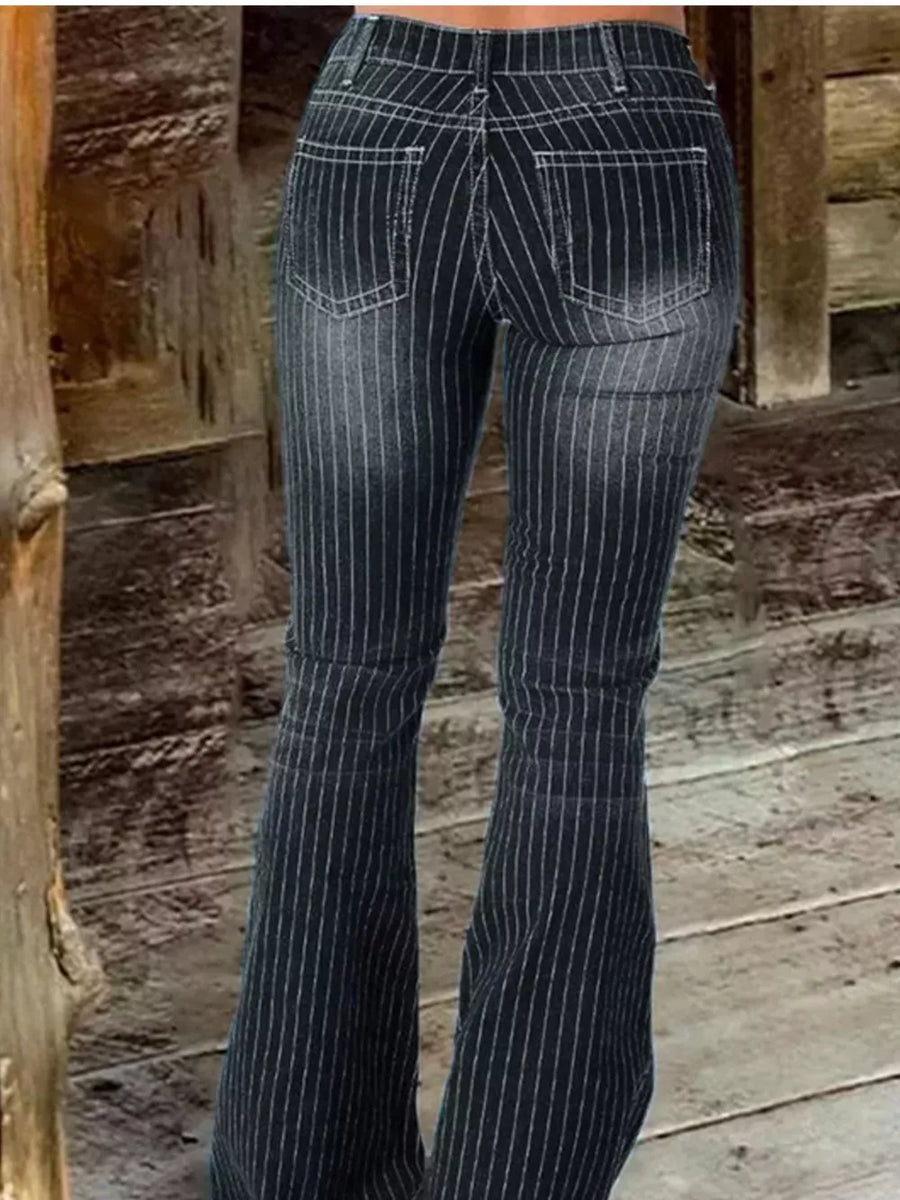 Black pinstripe flare maternity jeans with button fly and distressed denim detail.