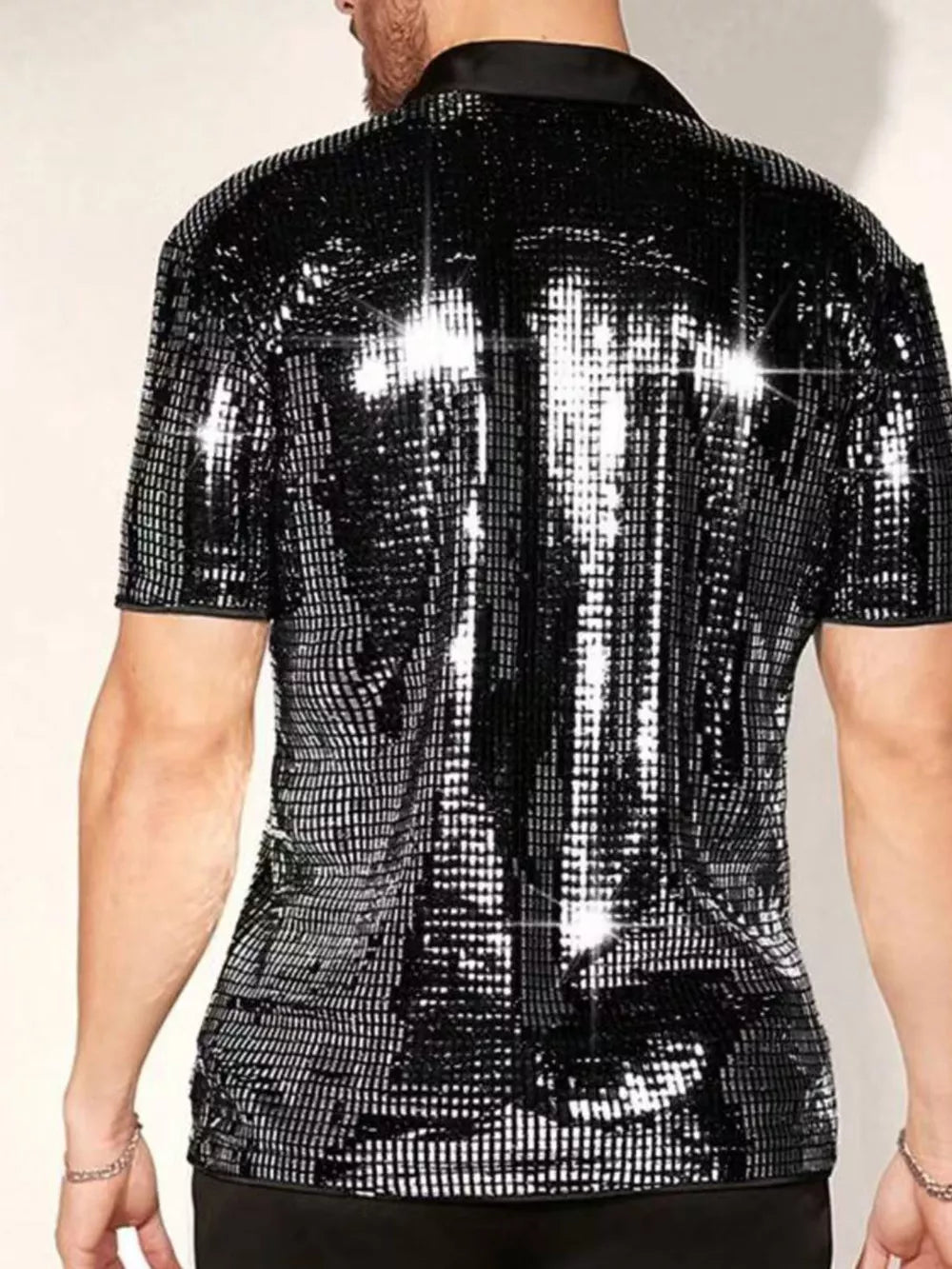 silver button-up shirt featuring buttoned and sequin