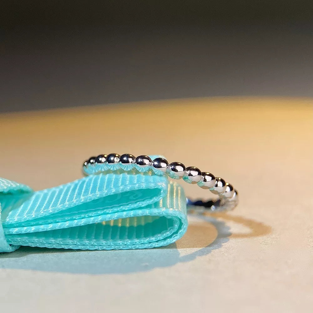 ring in silver featuring beaded design and fitted fit