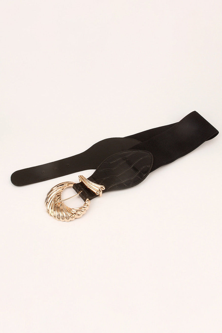 Black elastic belt with croc-embossed detail and sculptural gold buckle.