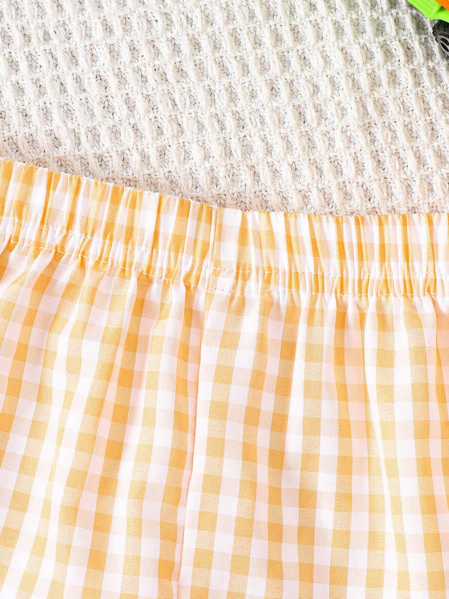 Baby shorts with yellow and white gingham pattern and elastic waistband