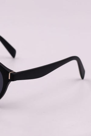 Black round frame sunglasses with gold accent detail on temple
