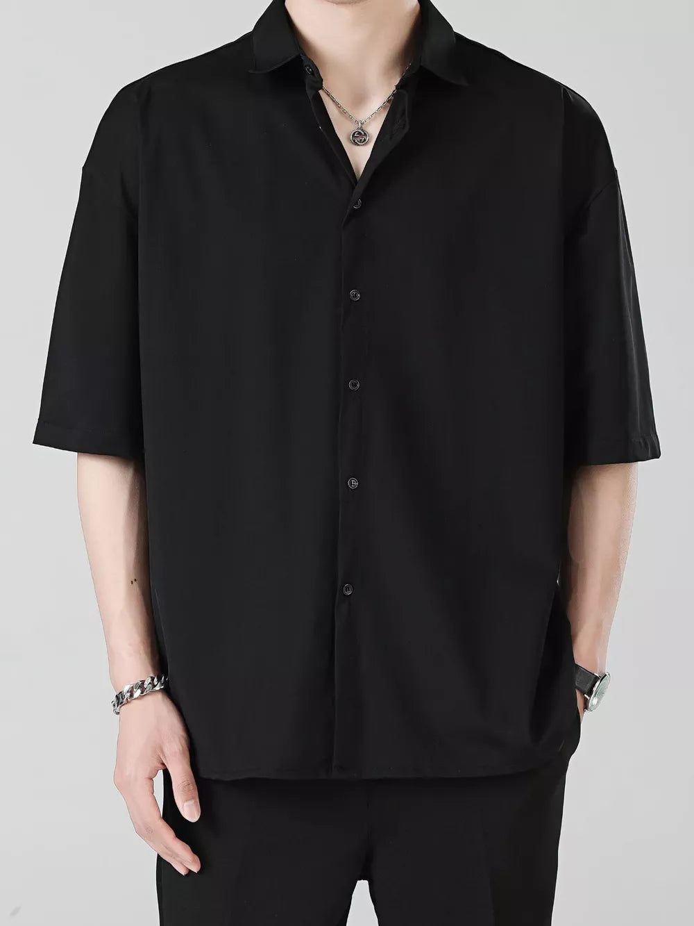 Men's black short sleeve button-down shirt with spread collar